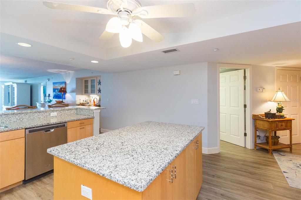 16326 Gulf Boulevard, Unit 109 Redington Beach, FL 33708 - Photo 10 of 63 a kitchen with center island table and chairs