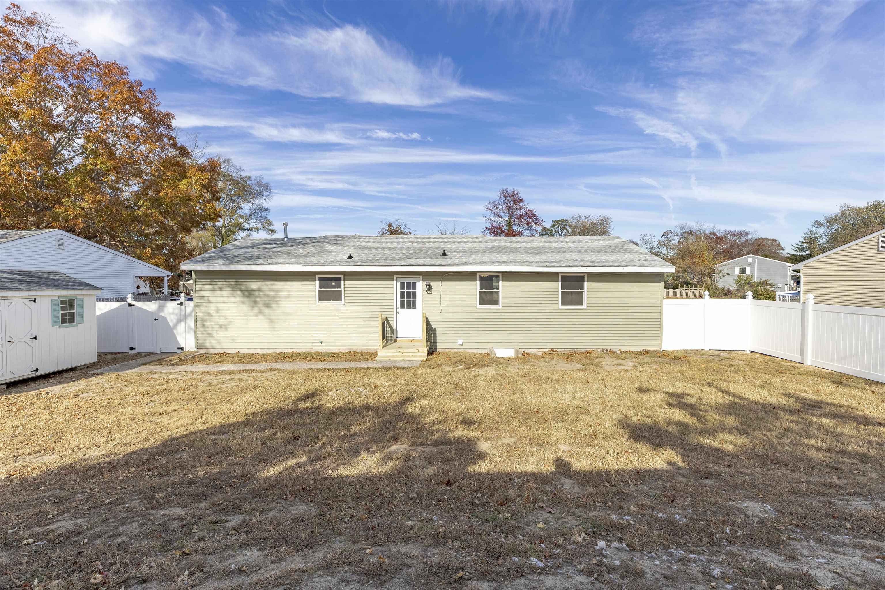 116 Orchard Drive North Cape May, NJ 08204 - Photo 25 of 32 a front view of a house with a yard and garage