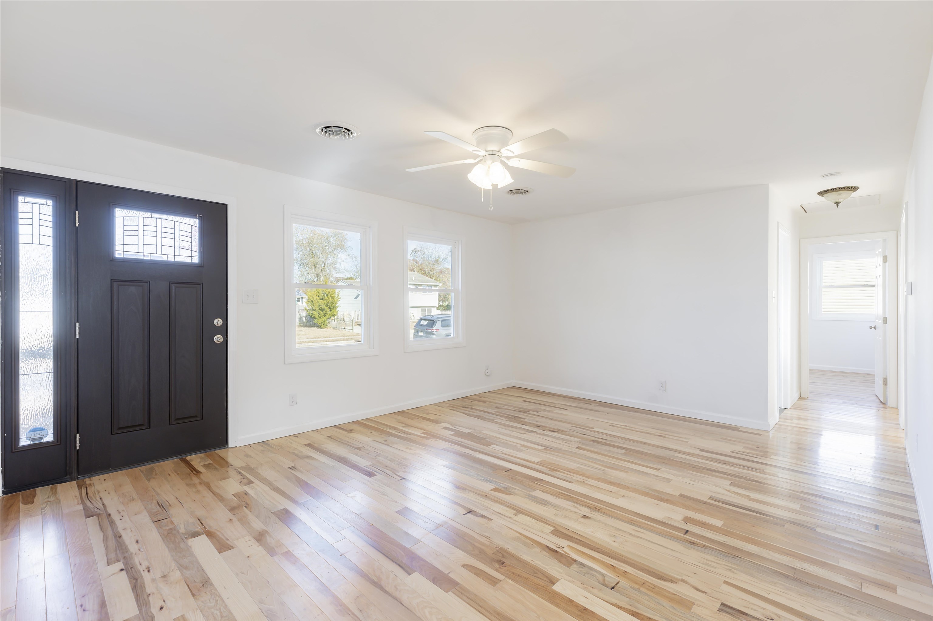 116 Orchard Drive North Cape May, NJ 08204 - Photo 4 of 32 a view of empty room with wooden floor and fan
