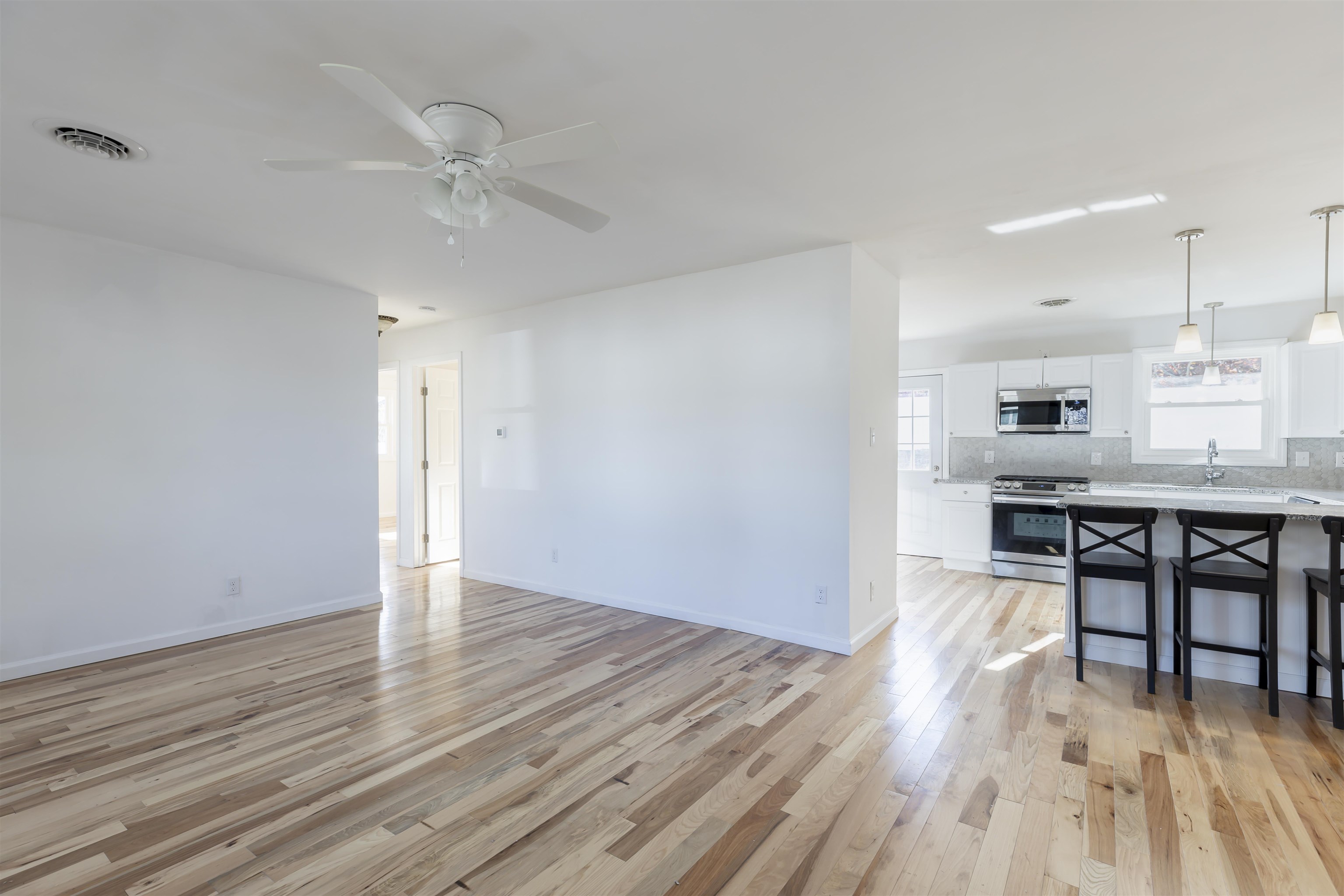 116 Orchard Drive North Cape May, NJ 08204 - Photo 5 of 32 a view of a kitchen with furniture and wooden floor
