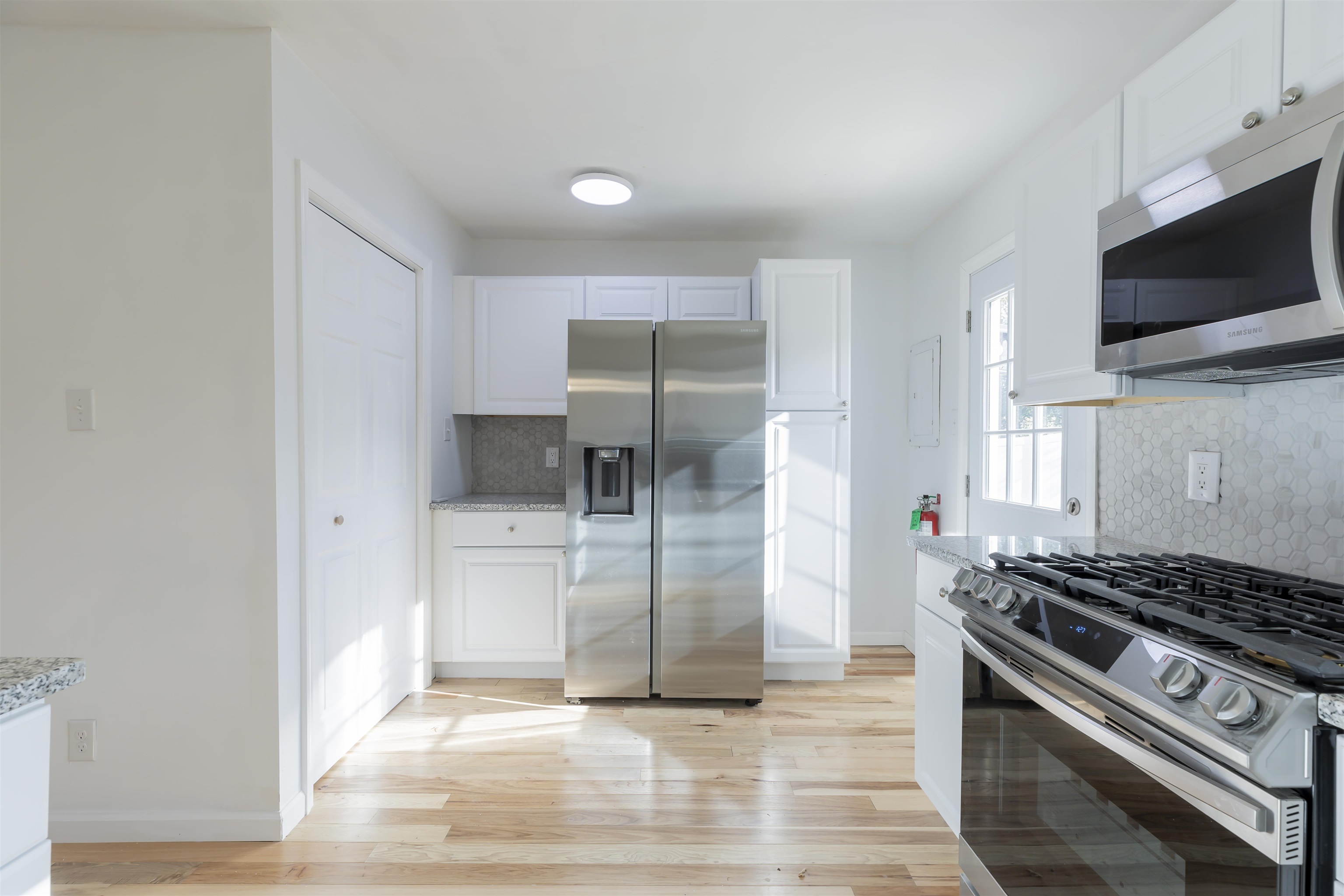 116 Orchard Drive North Cape May, NJ 08204 - Photo 8 of 32 a kitchen with a stove and a microwave
