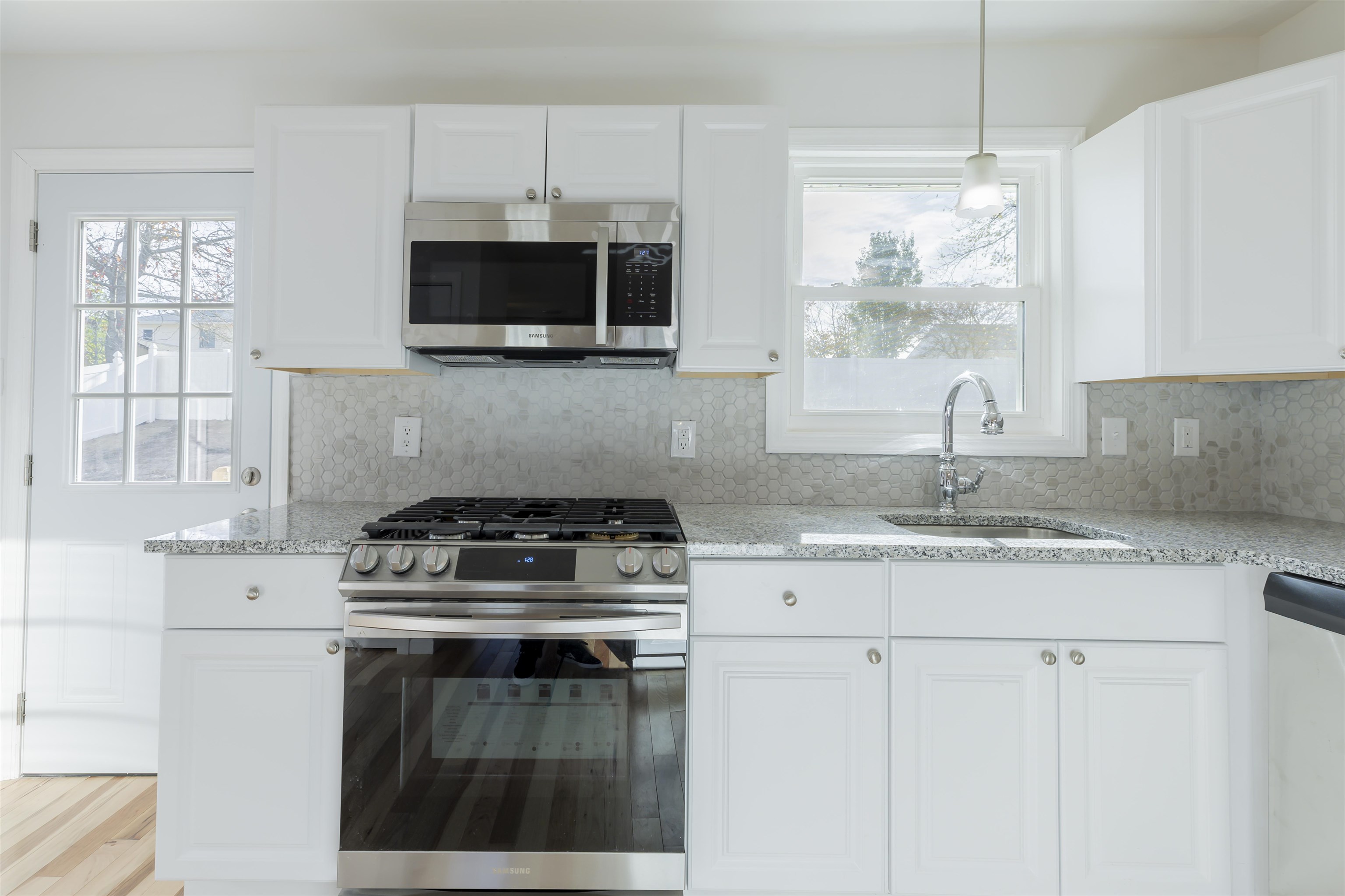 116 Orchard Drive North Cape May, NJ 08204 - Photo 9 of 32 a kitchen with stainless steel appliances granite countertop a stove a microwave and a sink