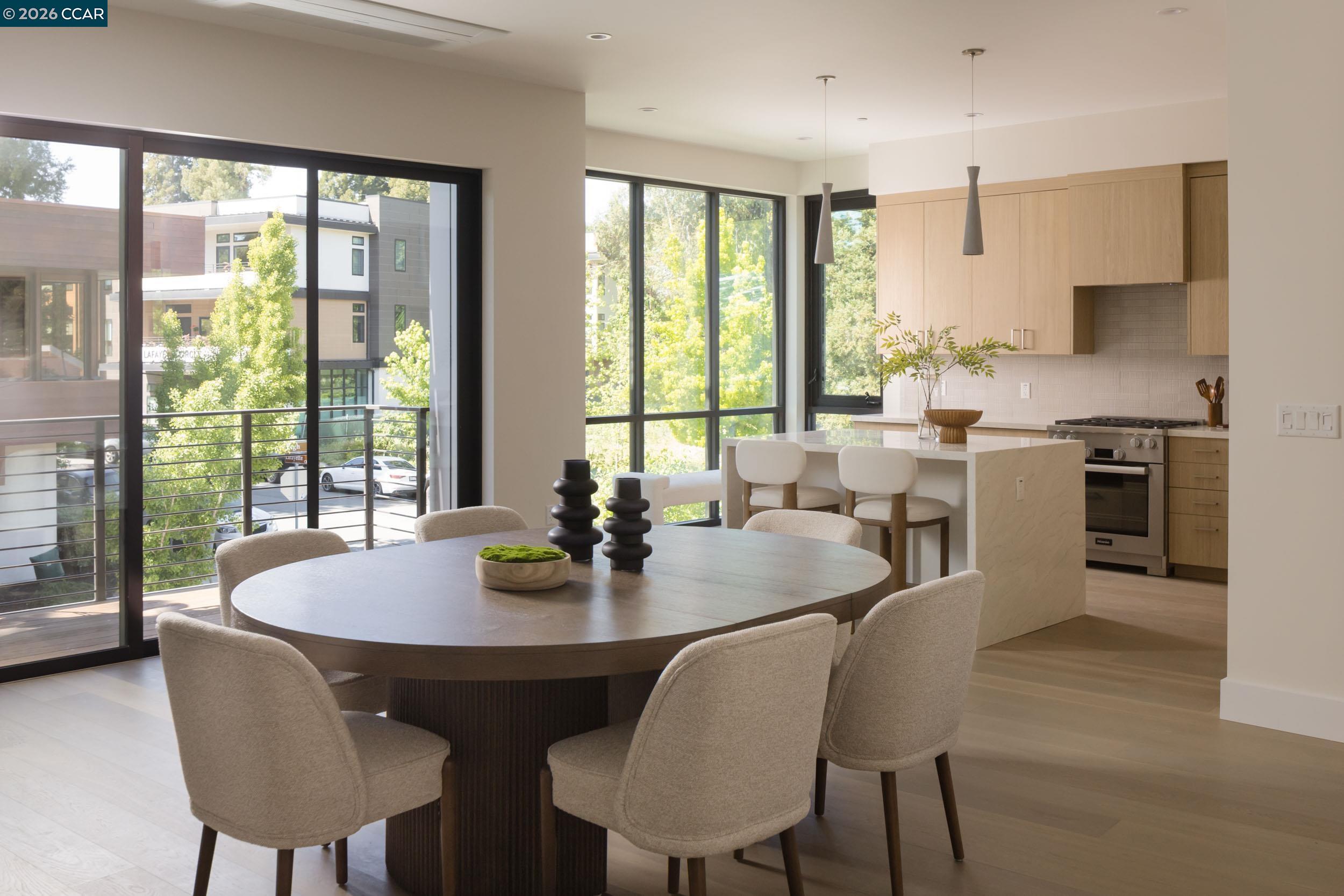 950 Hough Avenue, Unit 202 Lafayette, CA 94549 - Photo 6 of 38 a view of a dining room with furniture and a large window