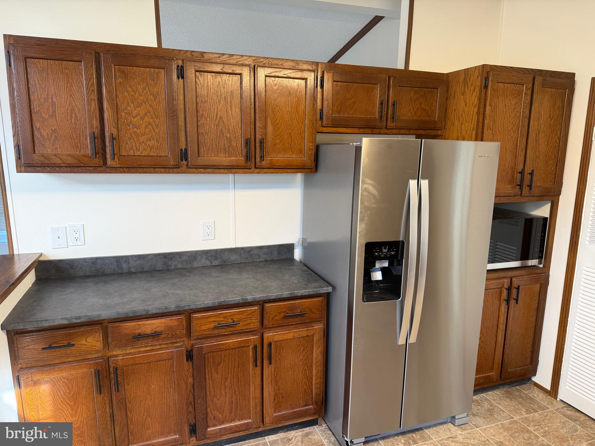 300 Brook Road Atglen, PA 19310 - Photo 5 of 42 a kitchen with stainless steel appliances granite countertop a refrigerator and cabinets