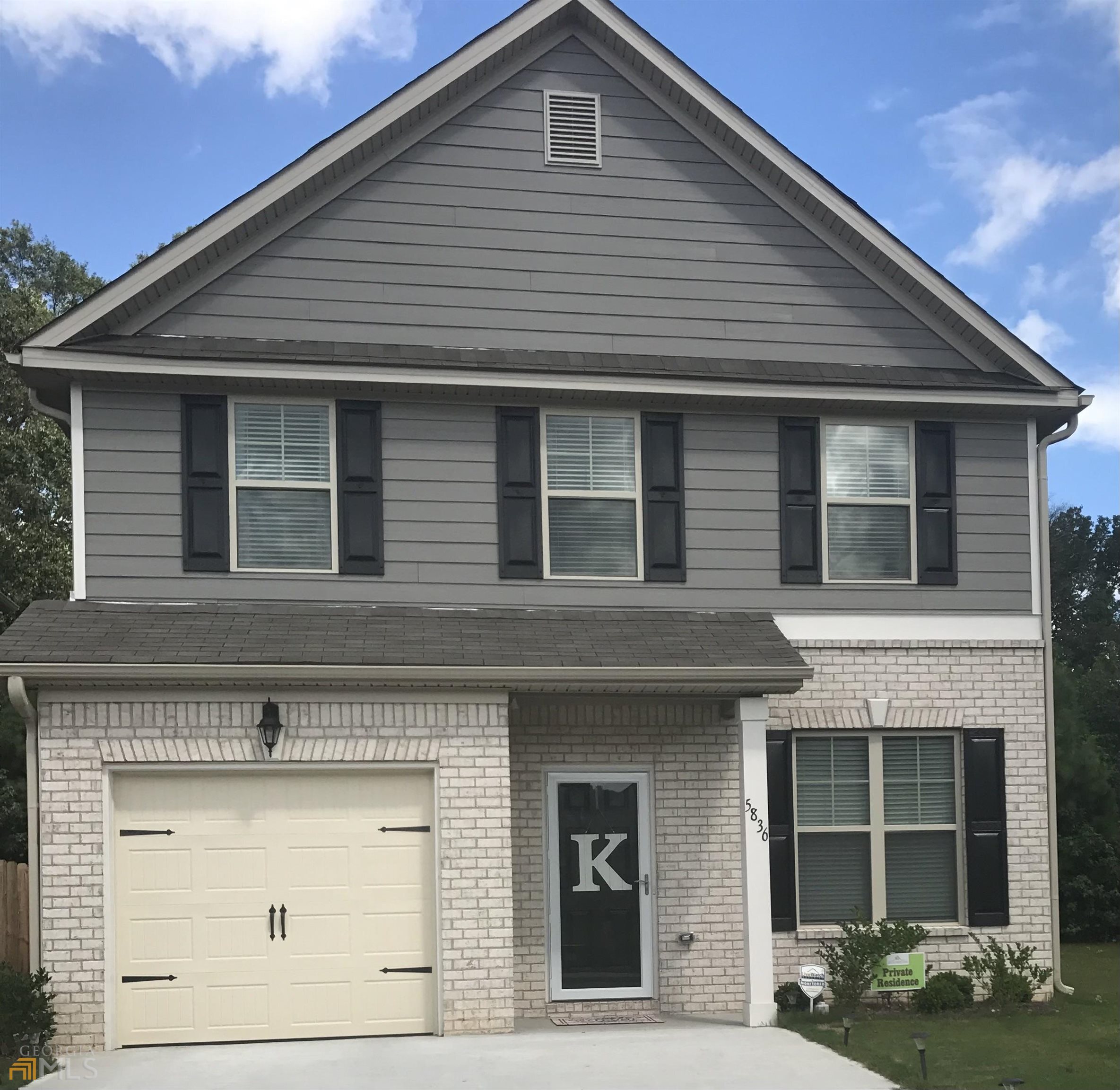 5836 Grande River Road Atlanta, GA 30349 - Photo 1 of 1 a front view of a house