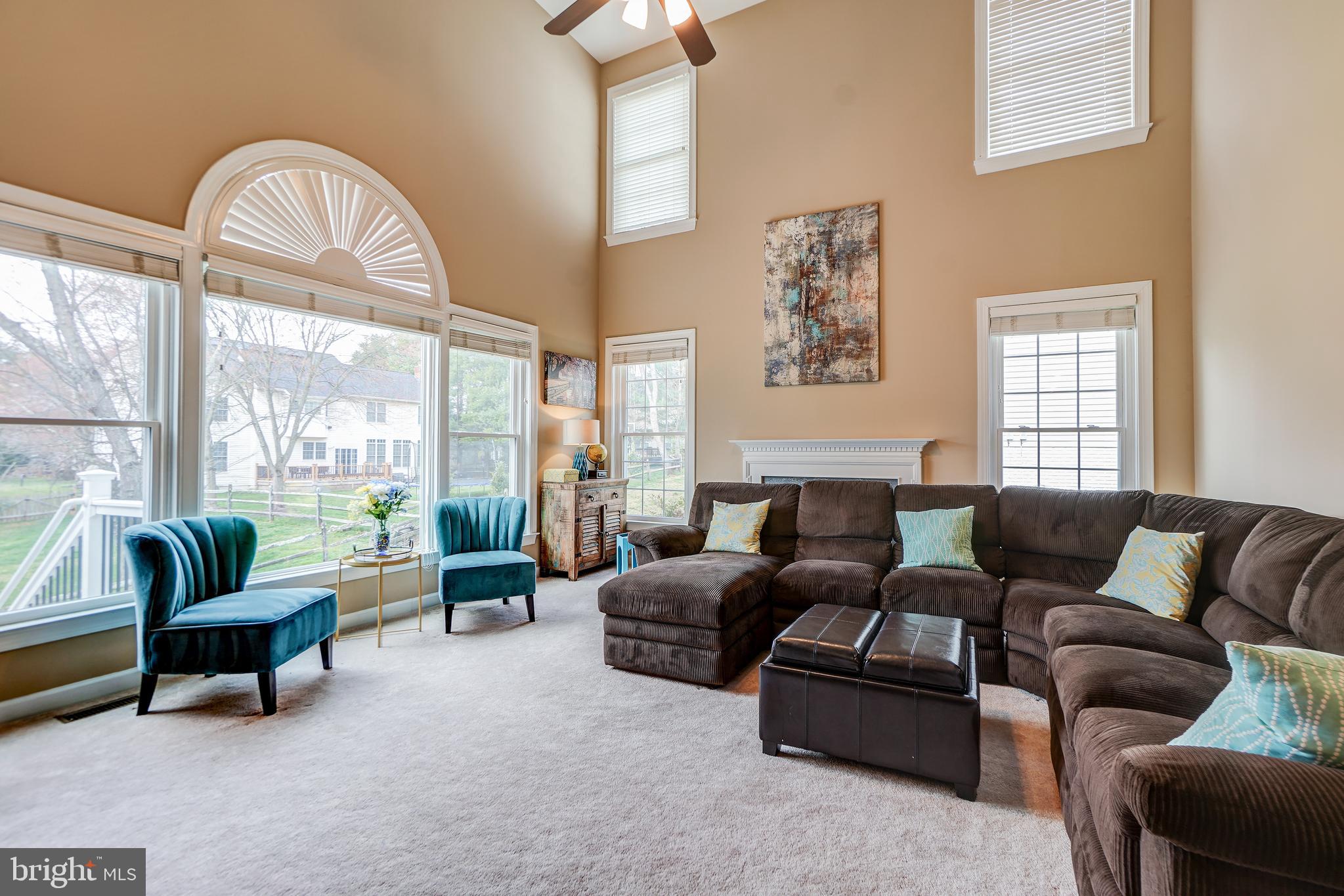 12108 Damson Drive North Potomac, MD 20878 - Photo 12 of 47 Light- Filled Two-Story Family Room with Fireplace