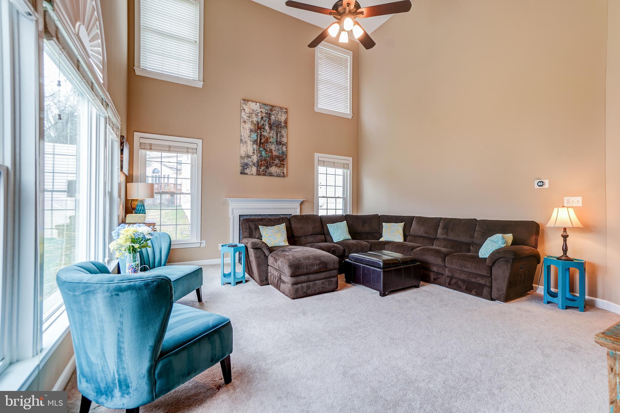 12108 Damson Drive North Potomac, MD 20878 - Photo 13 of 47 Light- Filled Two-Story Family Room with Fireplace