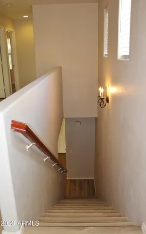 a view of staircase with white walls