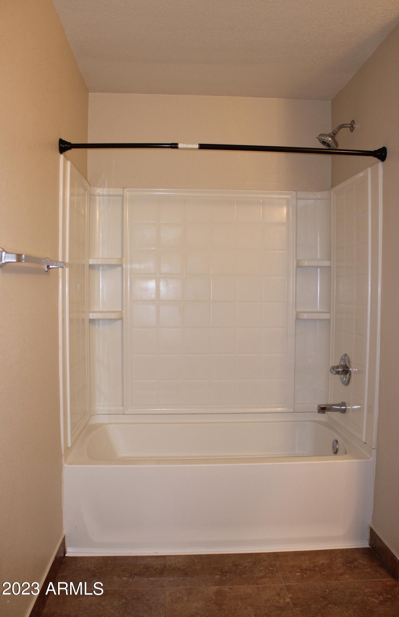 17278 North 184th Drive Surprise, AZ 85374 - Photo 22 of 32 a bathroom with a shower and a bath tub