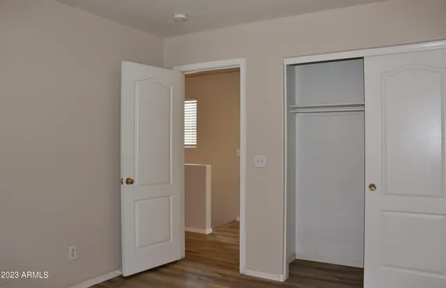 a view of room with wooden floor