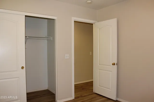 a view of a livingroom with wooden floor