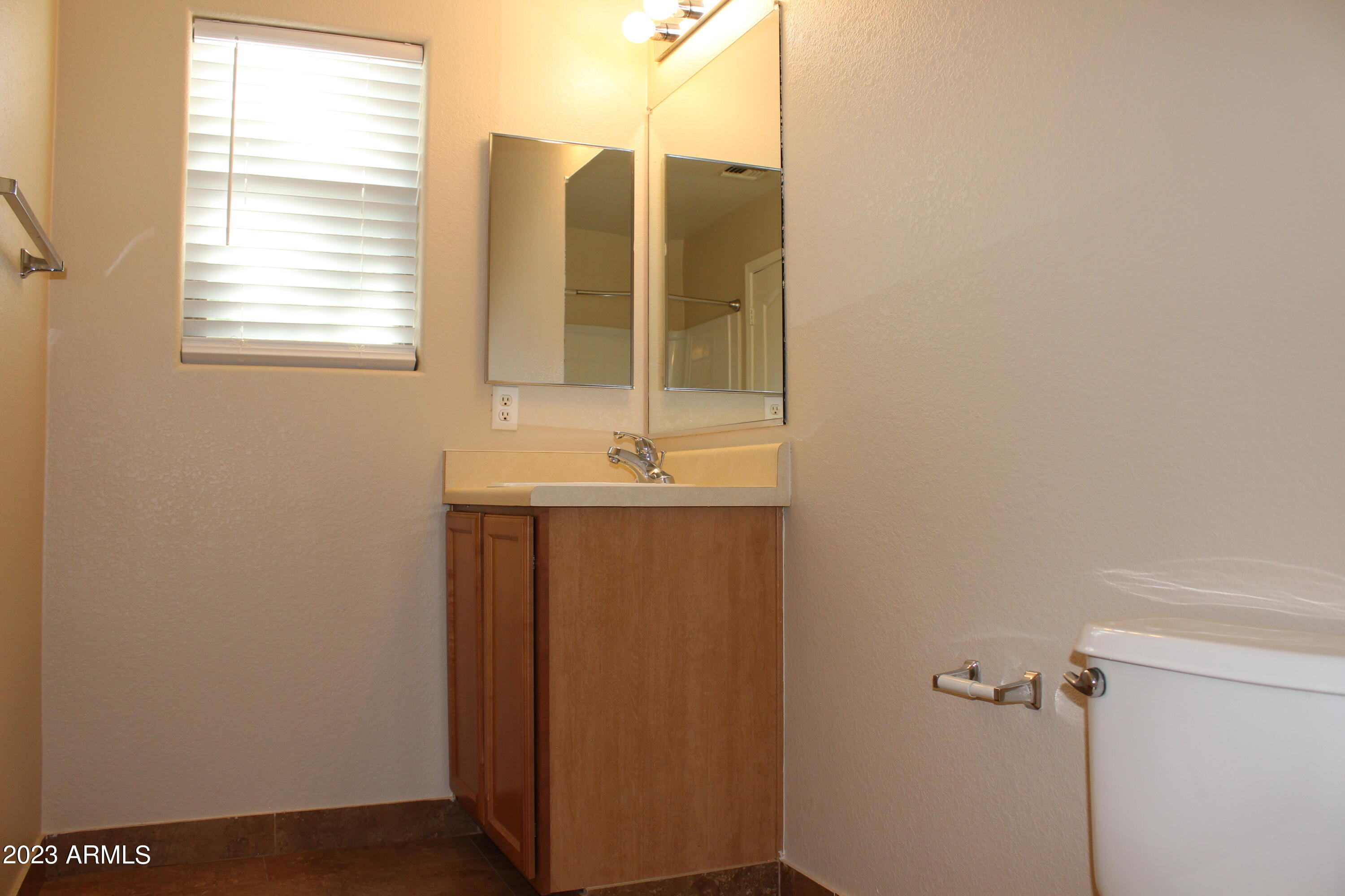 17278 North 184th Drive Surprise, AZ 85374 - Photo 29 of 32 a bathroom with a sink and a mirror