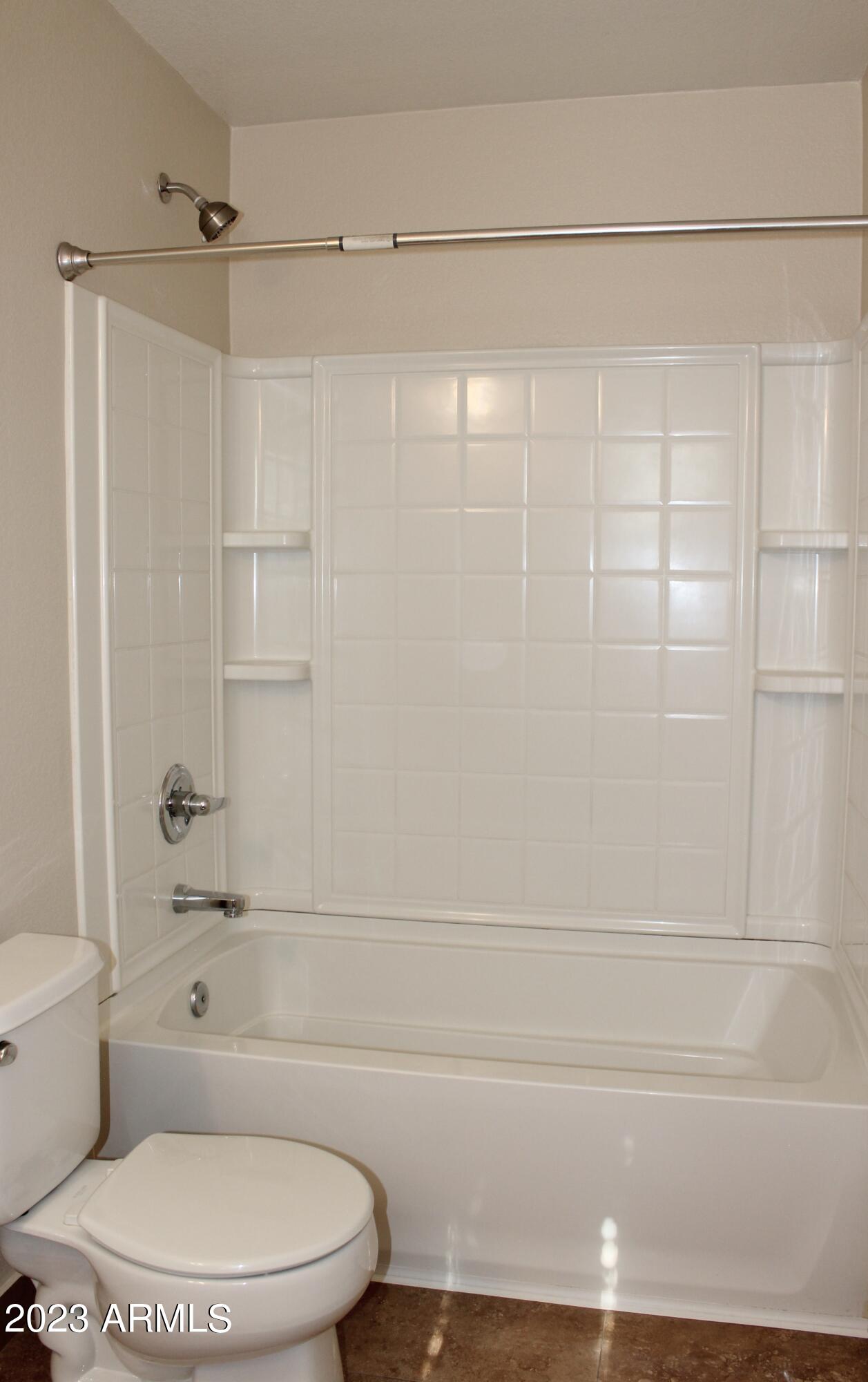 17278 North 184th Drive Surprise, AZ 85374 - Photo 30 of 32 a bathroom with a toilet and a shower