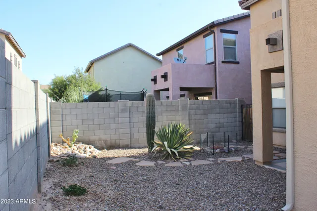 a view of a house with a yard and plants