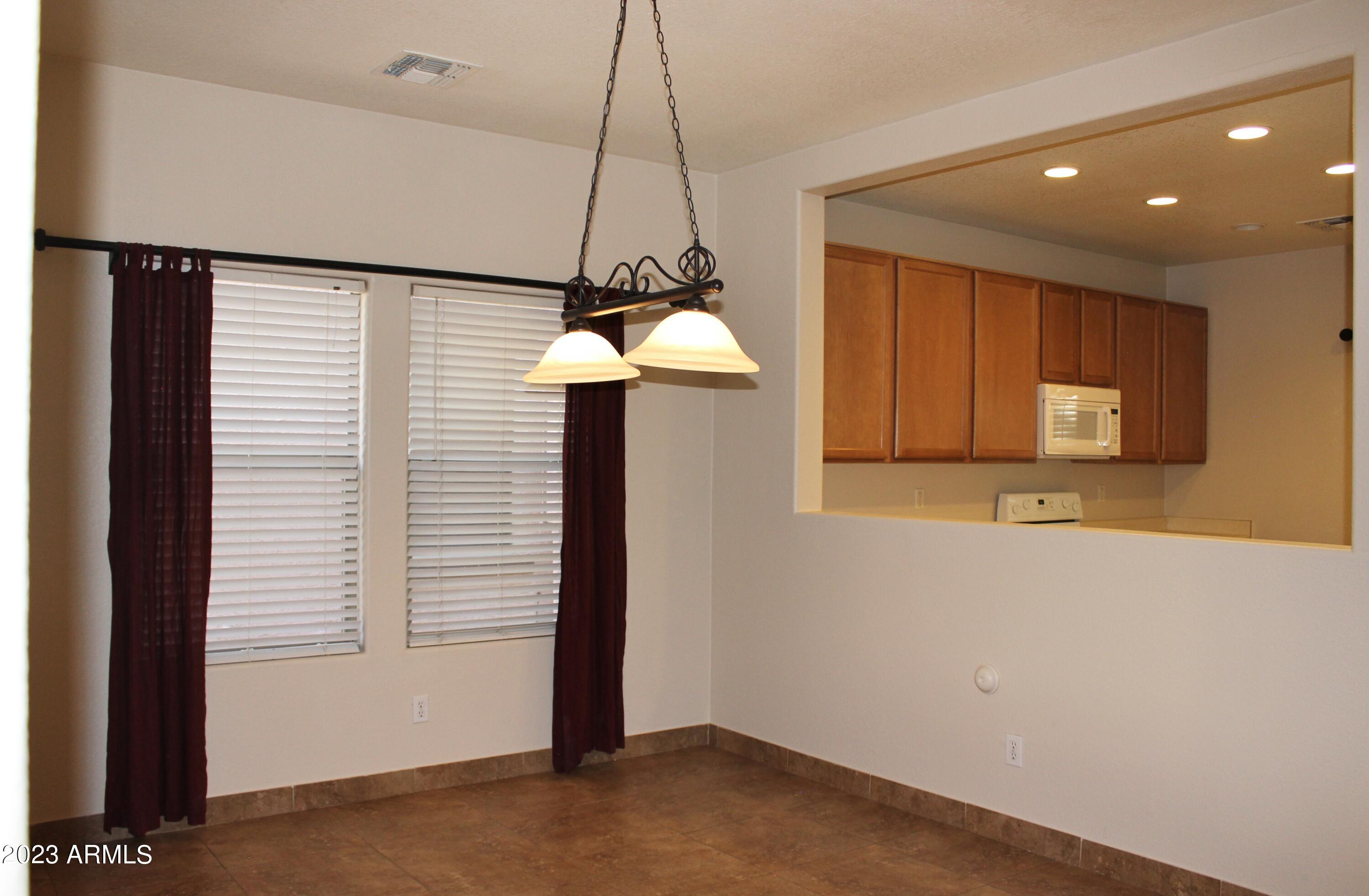 17278 North 184th Drive Surprise, AZ 85374 - Photo 10 of 32 a view of a kitchen with a sink and a window