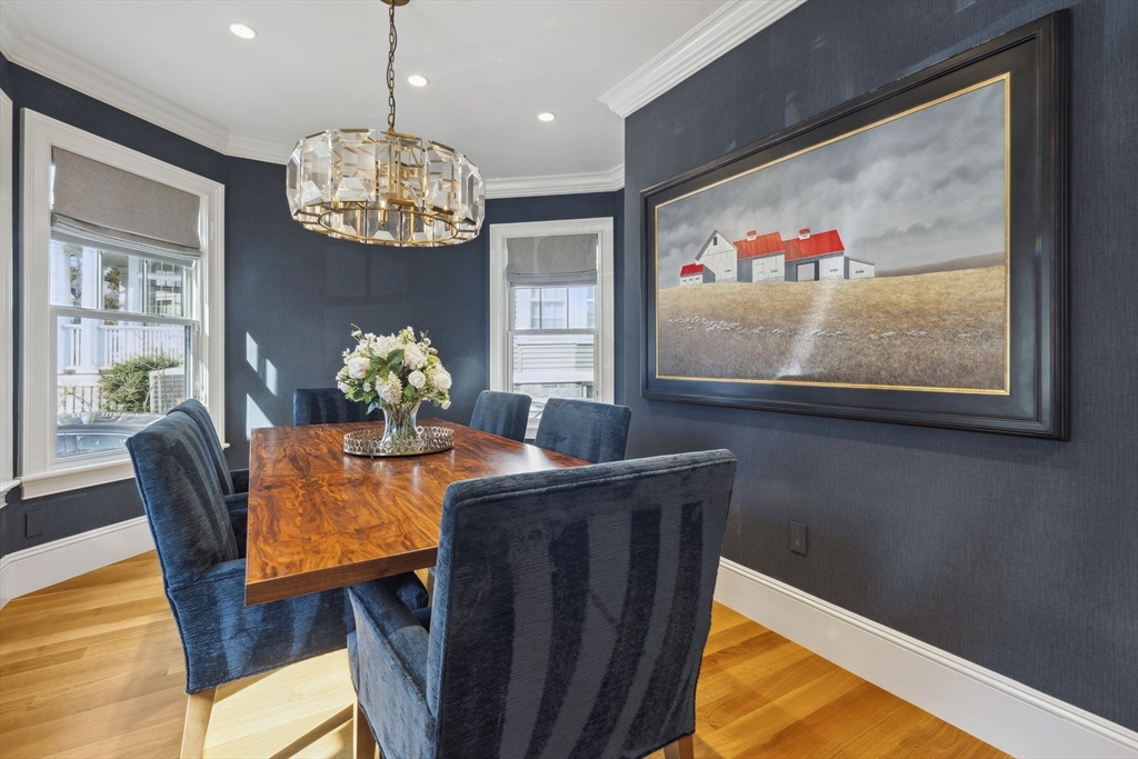 73 Upland Road Cambridge, MA 02140 - Photo 12 of 42 a dining room with furniture and chandelier