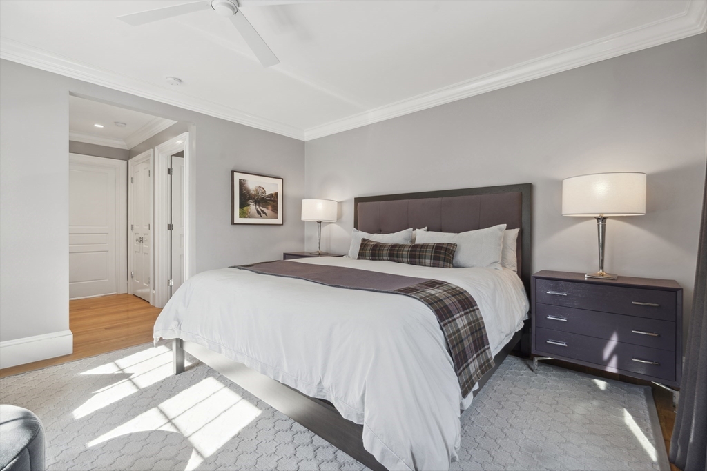 73 Upland Road Cambridge, MA 02140 - Photo 20 of 42 a bedroom with a bed and a lamp