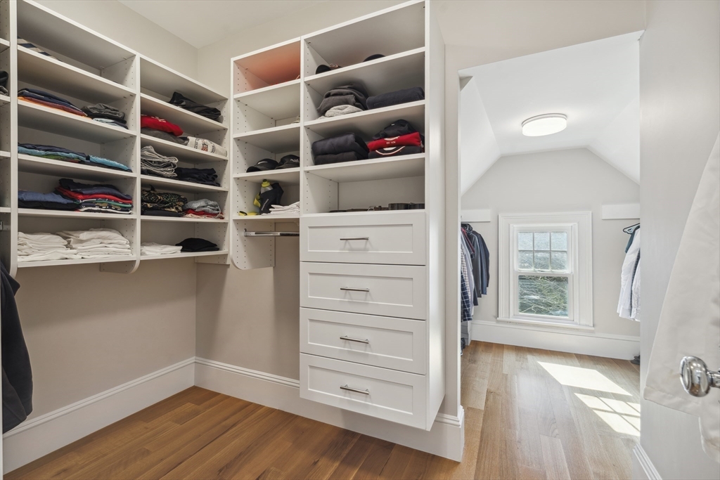 73 Upland Road Cambridge, MA 02140 - Photo 23 of 42 a view of walk in closet with clothes and shoes