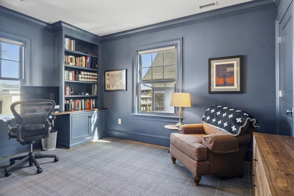73 Upland Road Cambridge, MA 02140 - Photo 29 of 42 a bedroom with a bed and a bookshelf