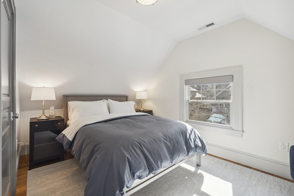 73 Upland Road Cambridge, MA 02140 - Photo 31 of 42 a bedroom with a bed and a window