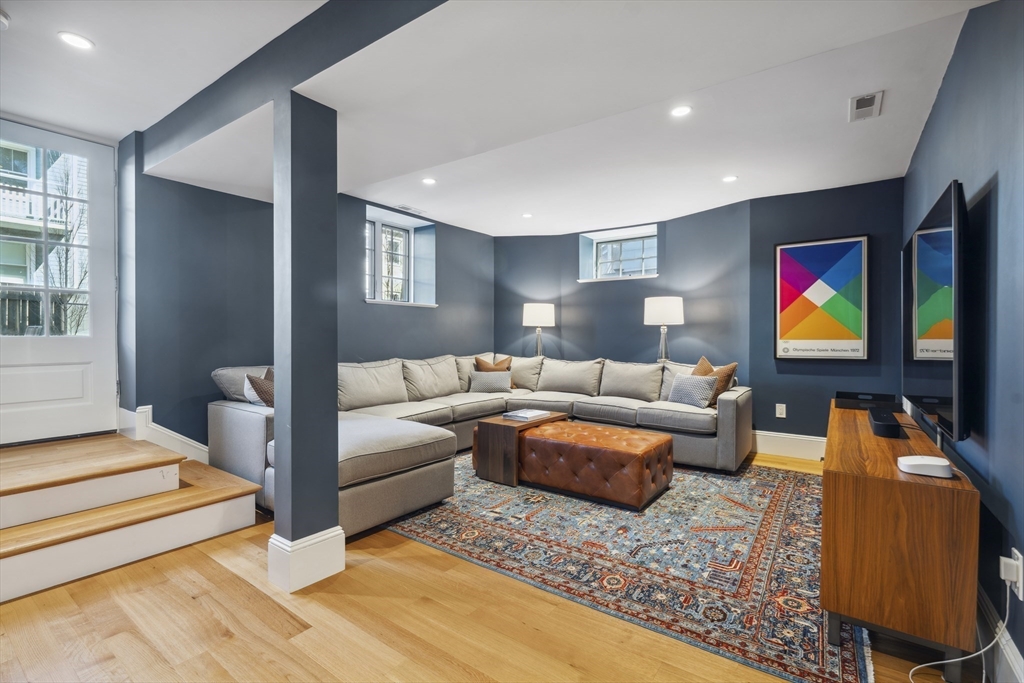 73 Upland Road Cambridge, MA 02140 - Photo 33 of 42 a living room with furniture and a flat screen tv