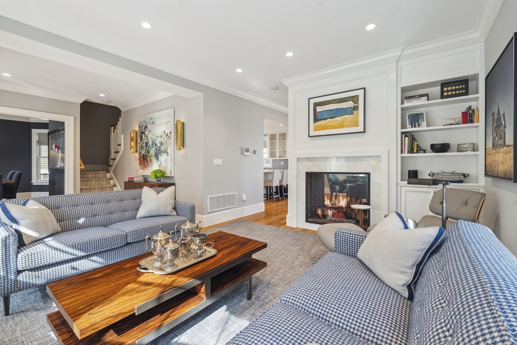 73 Upland Road Cambridge, MA 02140 - Photo 5 of 42 a living room with furniture and a fireplace