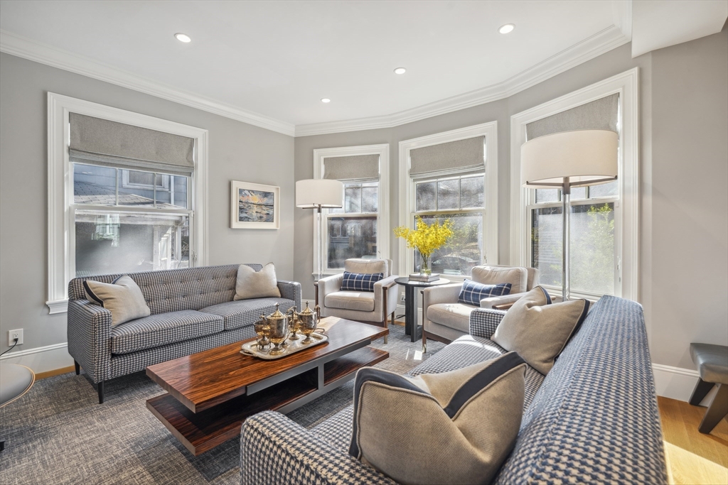 73 Upland Road Cambridge, MA 02140 - Photo 6 of 42 a living room with furniture and a large window