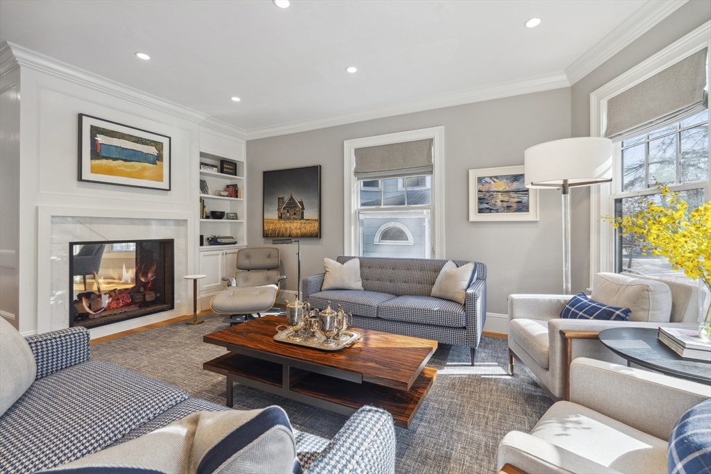 73 Upland Road Cambridge, MA 02140 - Photo 7 of 42 a living room with furniture and a fireplace