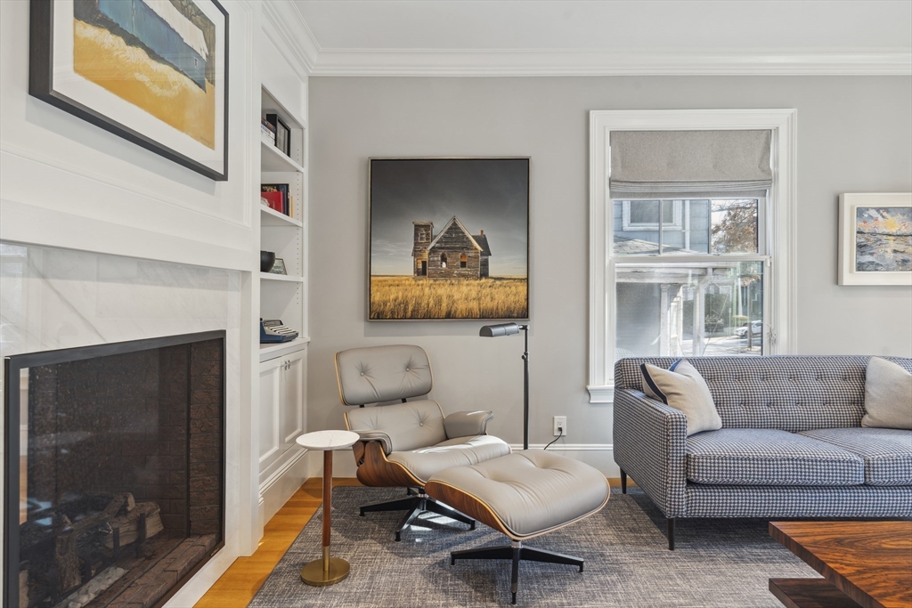 73 Upland Road Cambridge, MA 02140 - Photo 8 of 42 a living room with furniture a window and a fireplace