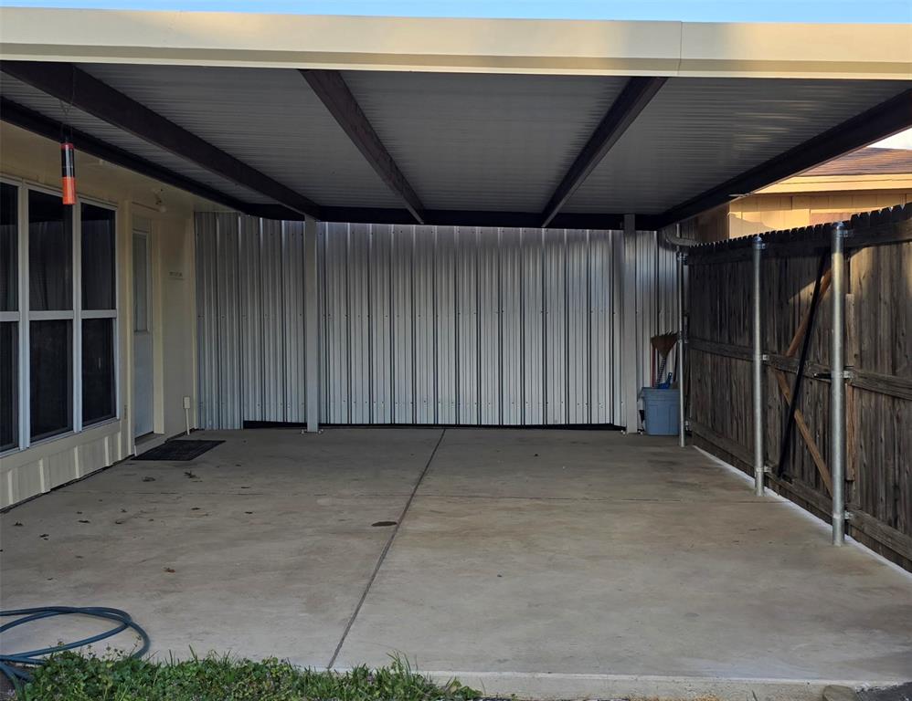 2224 Limestone Lane Garland, TX 75040 - Photo 15 of 16 a view of an empty room with wooden walls