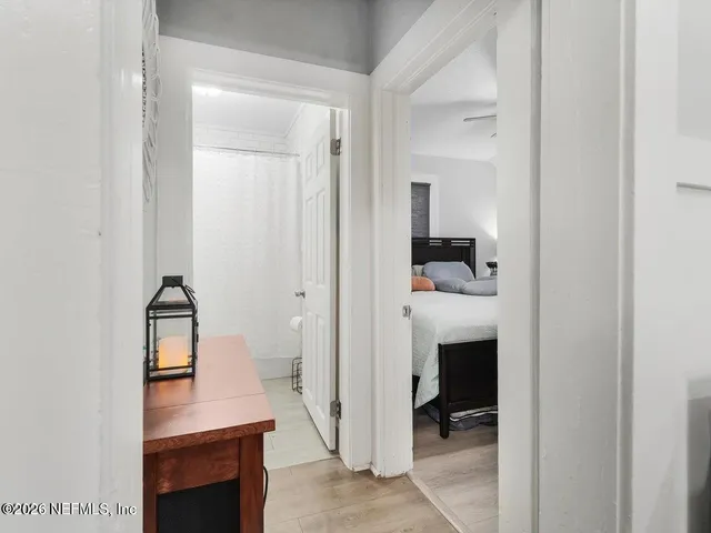 a view of hallway with livingroom and stairs