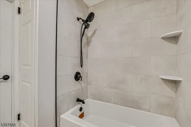 a bathroom with a bath tub