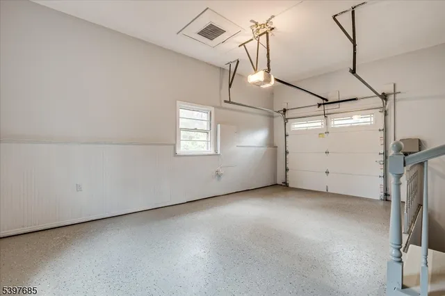 a view of a room with cabinet and windows