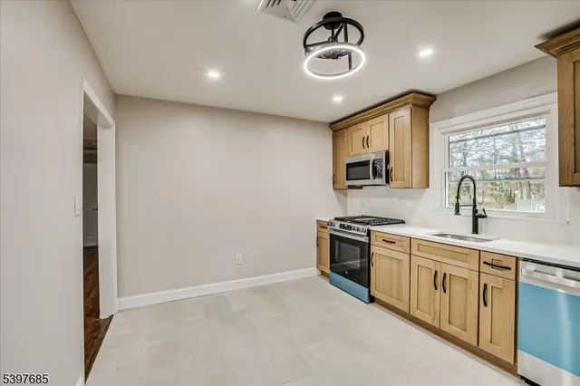 a kitchen with a stove and a sink