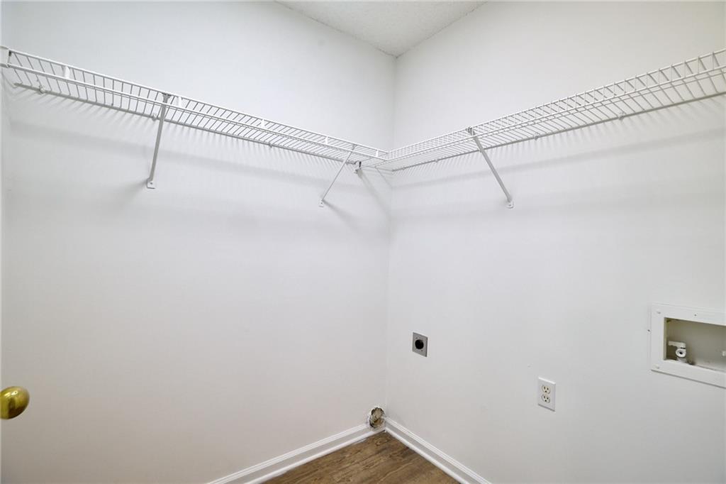 1645 Fort Mason Way Dacula, GA 30019 - Photo 13 of 28 a view of a room with racks on the wall