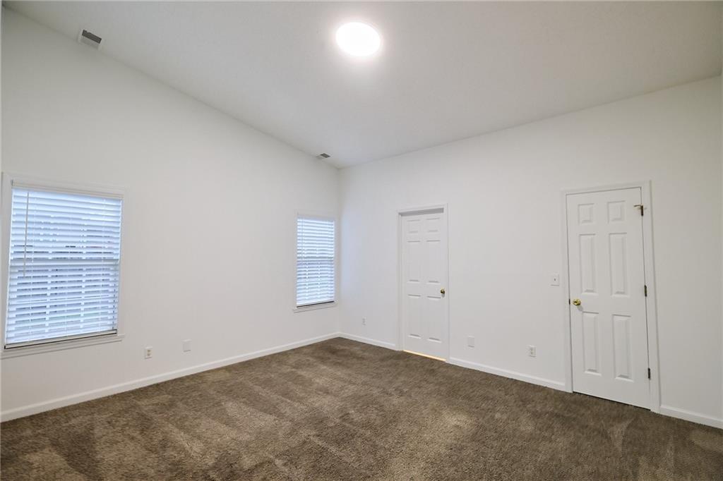 1645 Fort Mason Way Dacula, GA 30019 - Photo 14 of 28 a view of an empty room and a window