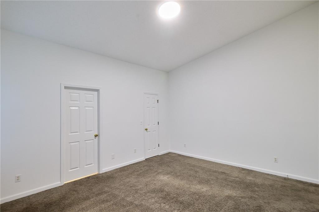1645 Fort Mason Way Dacula, GA 30019 - Photo 15 of 28 an empty room with closet area