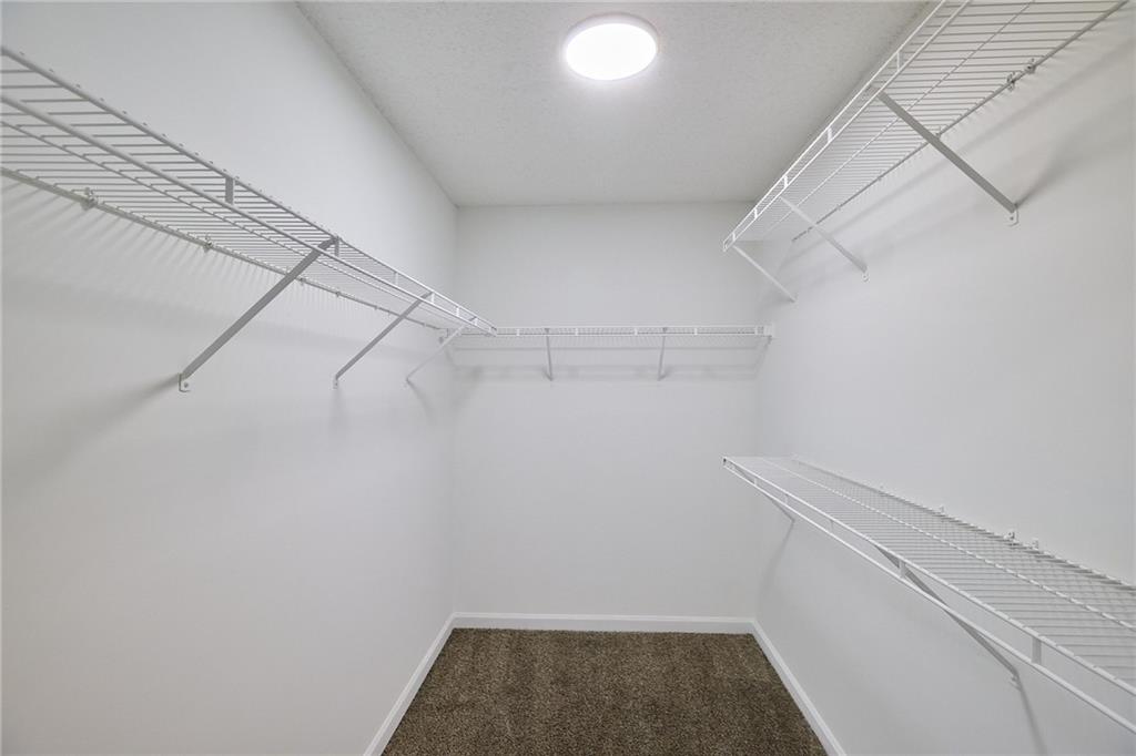 1645 Fort Mason Way Dacula, GA 30019 - Photo 18 of 28 a view of a room with racks on the wall