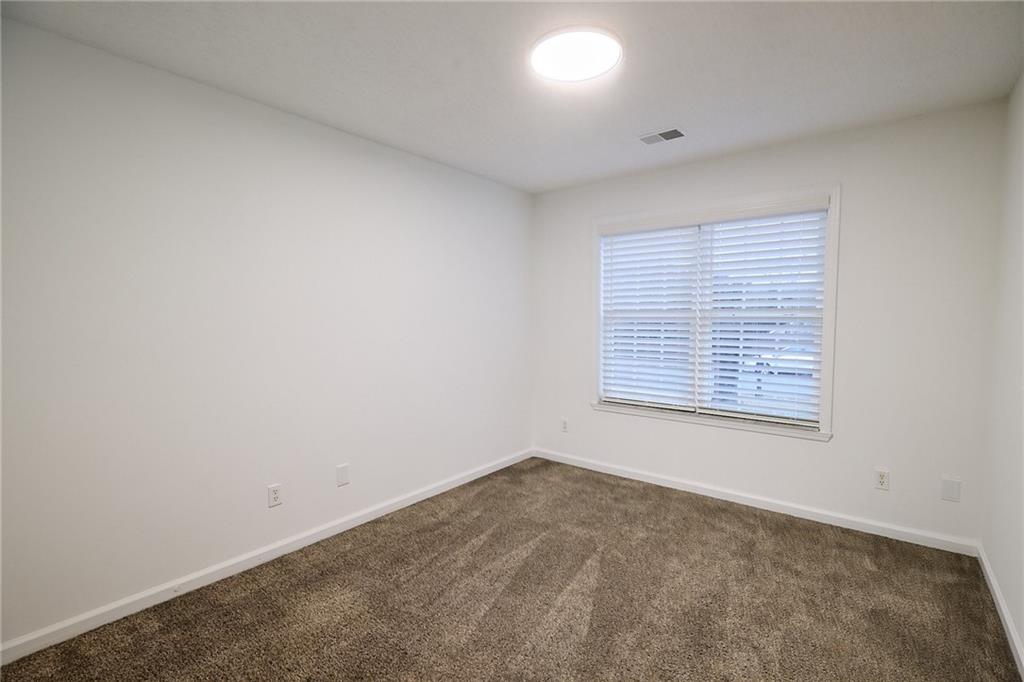 1645 Fort Mason Way Dacula, GA 30019 - Photo 19 of 28 an empty room with a window