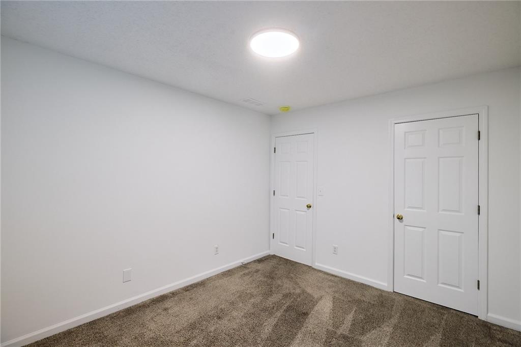 1645 Fort Mason Way Dacula, GA 30019 - Photo 20 of 28 a view of an empty room