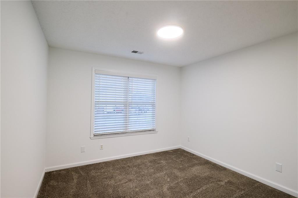 1645 Fort Mason Way Dacula, GA 30019 - Photo 21 of 28 an empty room with a window