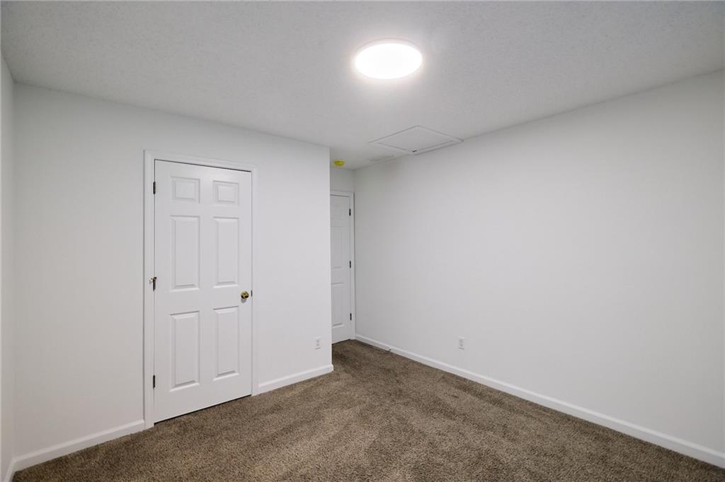 1645 Fort Mason Way Dacula, GA 30019 - Photo 22 of 28 an empty room with windows