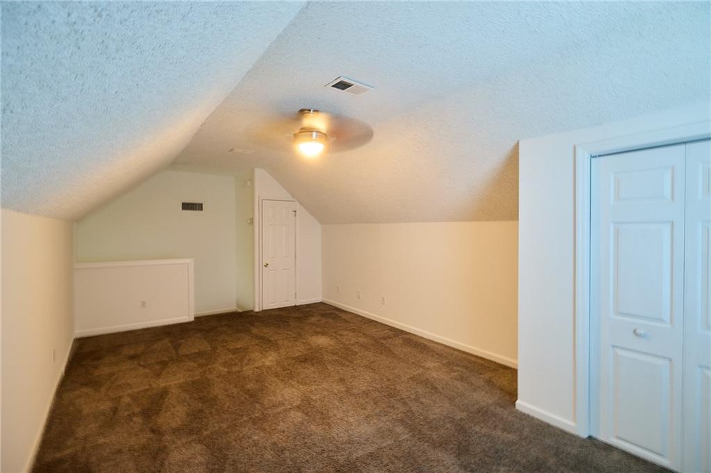 1645 Fort Mason Way Dacula, GA 30019 - Photo 25 of 28 a view of an empty room