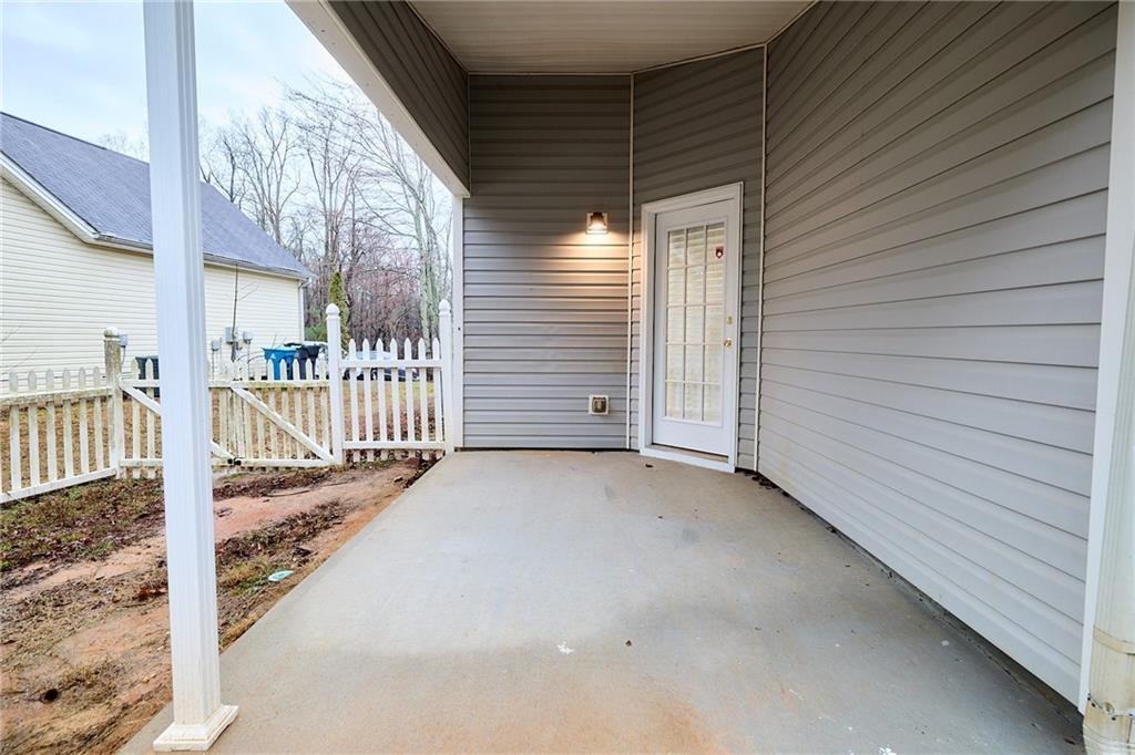 1645 Fort Mason Way Dacula, GA 30019 - Photo 26 of 28 a view of a porch with wooden stairs