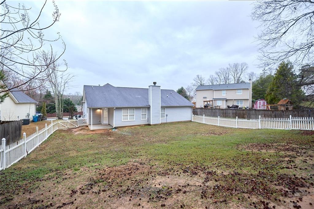 1645 Fort Mason Way Dacula, GA 30019 - Photo 27 of 28 a house view with a backyard space