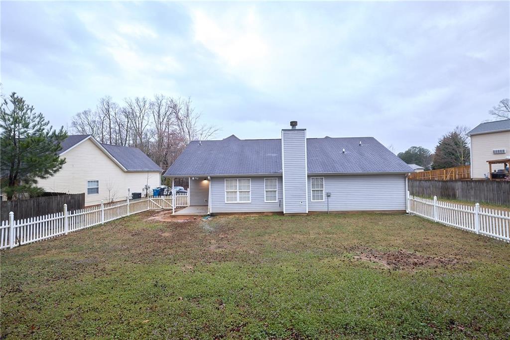 1645 Fort Mason Way Dacula, GA 30019 - Photo 28 of 28 front view of a house with a large trees