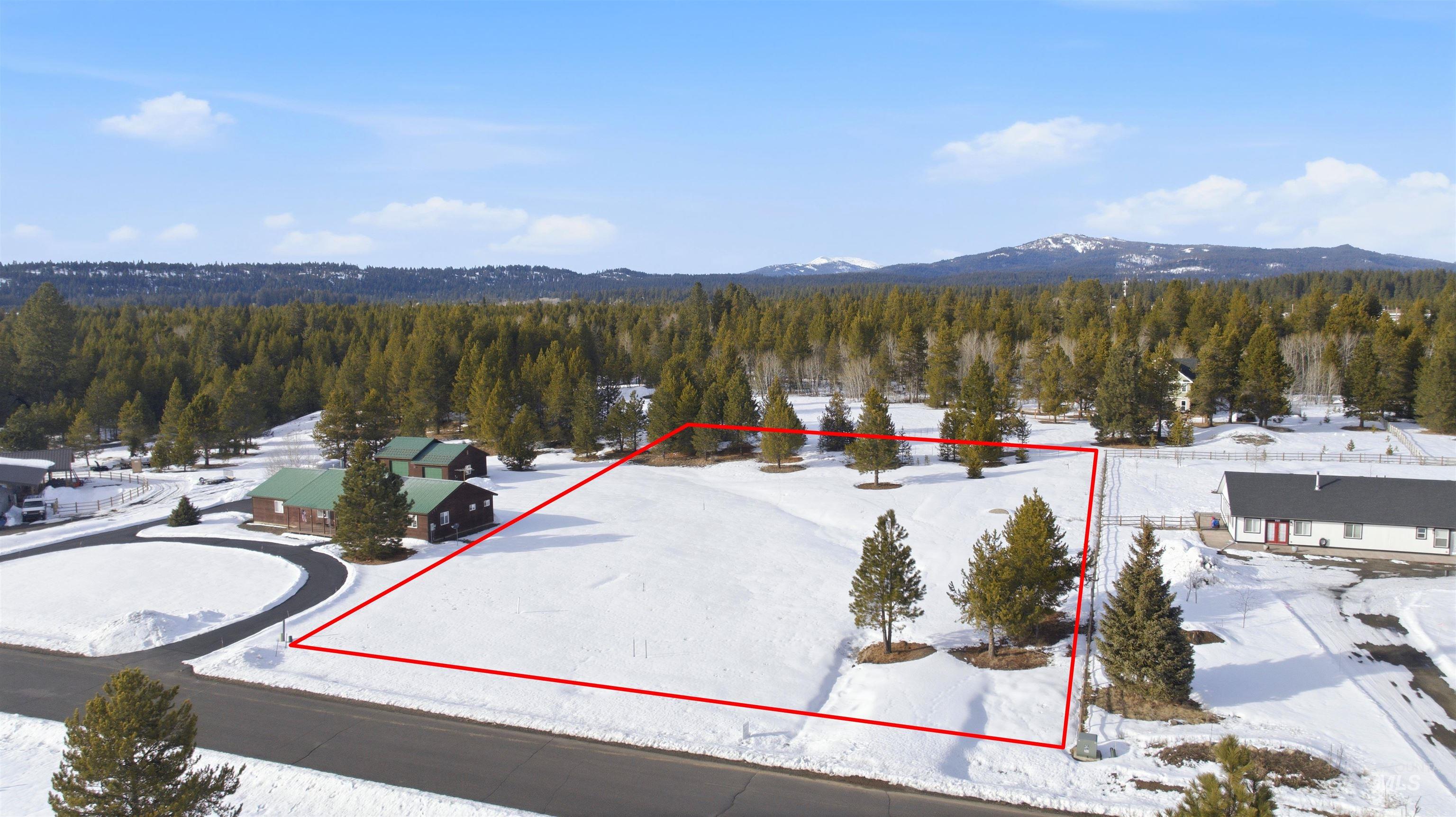 969 Valley View Lane McCall, ID 83638 - Photo 2 of 13 Aerial overview of property's location with property boundaries highlighted and a mountainous background