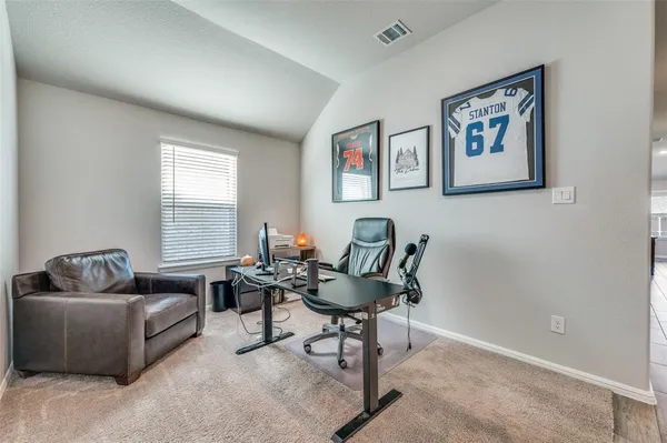 a living room with furniture and windows