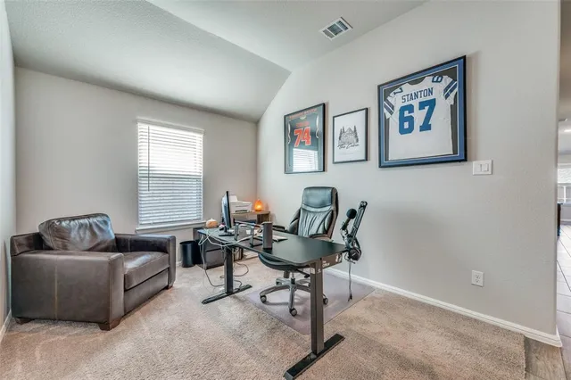 a living room with furniture and windows