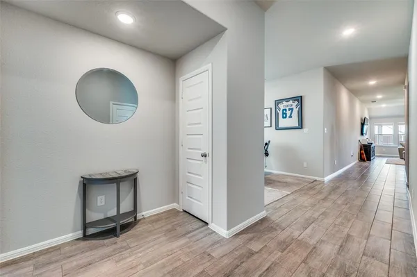 wooden floor in a hall with a mirror
